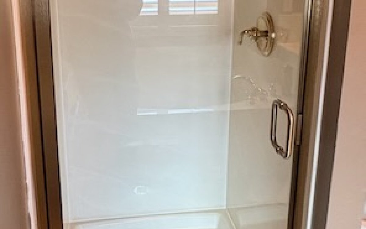semi-frameless shower door with new brushed bronze color